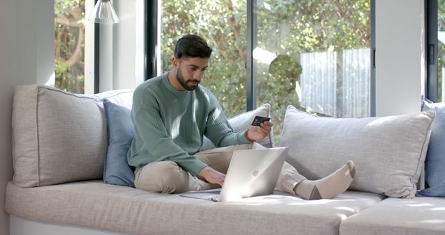 Man Shopping Online with Laptop and Credit Card at Home - Download Free Stock Images Pikwizard.com