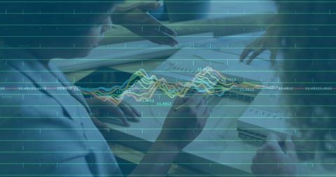 Business Team Analyzing Documents with Data Visualization Overlay