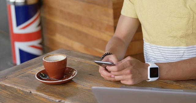 Person Using Smartphone in Cafe with Coffee and Smartwatch - Download Free Stock Images Pikwizard.com