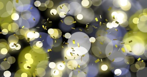 Glittering Gold Confetti with Festive Bokeh Lights Background