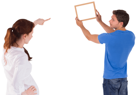 Creative Couple Deciding Picture Placement on Transparent Background