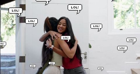 Young women hugging in sunlit entryway with pixel 'lol' speech bubbles, warm reunion