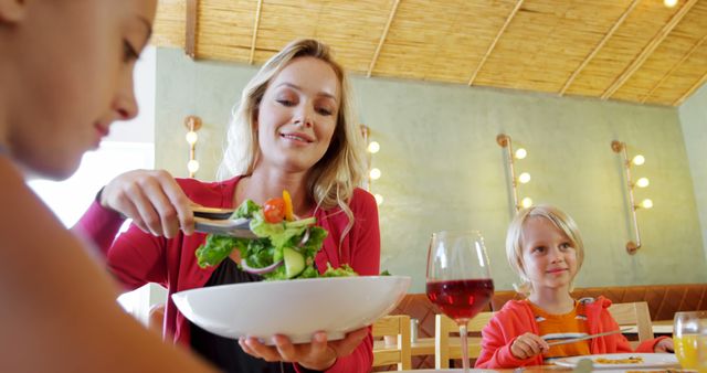 Mother and Children Enjoying Healthy Salad Meal at Restaurant - Download Free Stock Images Pikwizard.com