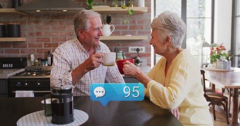 Senior couple enjoying coffee conversation in rustic kitchen