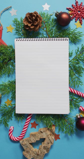 Vertical Notebook Surrounded by Christmas Decorations for Holiday Planning - Download Free Stock Images Pikwizard.com