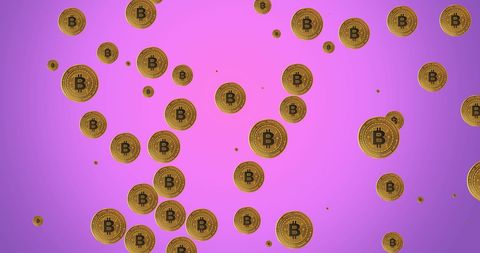 Floating bitcoins on bright purple background