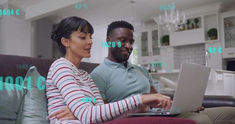 Couple Comparing Online Prices and Managing Home Finances on Laptop in Modern Living Room