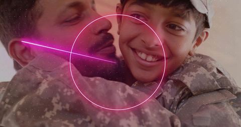 Soldier father hugging son in camouflage embracing cheek-to-cheek with neon circle overlay