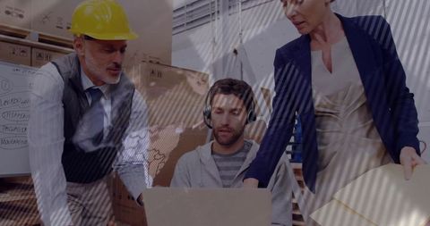 Warehouse team collaborating with technology and logistics plan