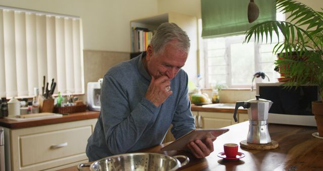 Senior Man Using Tablet in Cozy Home Kitchen - Download Free Stock Images Pikwizard.com