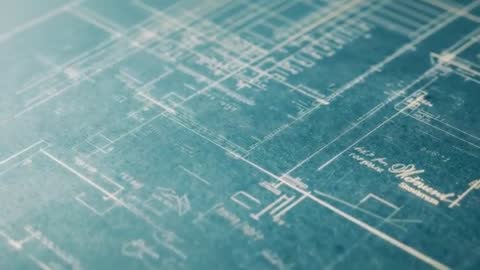 Tracking Camera Revealing Teal Architectural Blueprint Details with Soft Highlight Movement