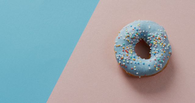 Blue Iced Donut with Colorful Sprinkles on Pastel Background - Download Free Stock Images Pikwizard.com