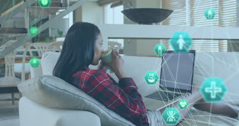 Woman Working on Laptop with Digital Health Network Animation
