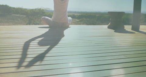 Serene Yoga Practice with Sunlight Streaming Through Porch