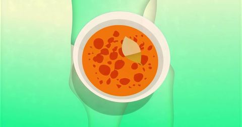 Woman in Swimwear Enhancing Relaxation with Bowl of Soup