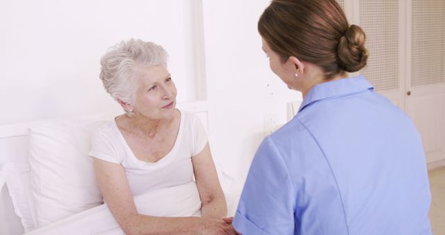 Nurse Talking to Elderly Patient in Hospital Room - Download Free Stock Images Pikwizard.com