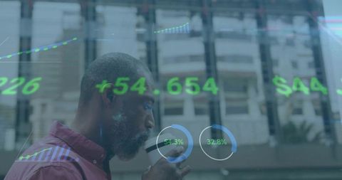 Focused Professional Reviewing Stock Market Data Overlaid on City Scene