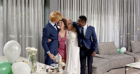 Joyful Wedding Celebration with Multiracial Friends in Living Room