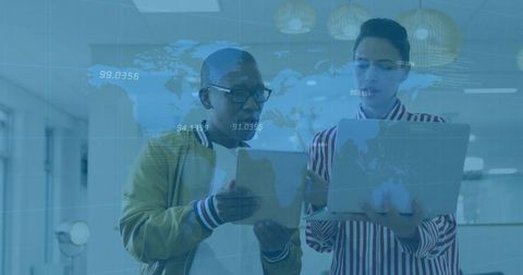 Digital Collaboration Team Analyzing World Map Data in Office Environment