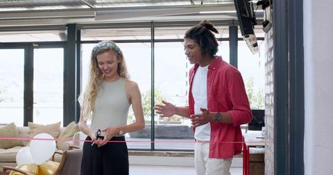 Grand opening ceremony decorated with balloons and ribbon cutting