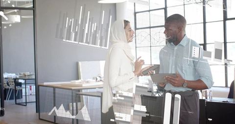 Diverse Professionals Collaborating with Digital Analytics in Modern Office