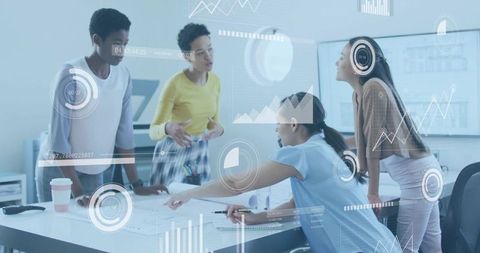 Diverse business team collaborating over plans with digital analytics overlays