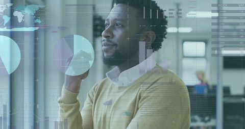 Thoughtful Businessman Analyzing Financial Data in Office Environment - Download Free Stock Images Pikwizard.com