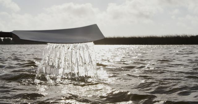 Water Splash from Paddle on Lake during Sunrise - Download Free Stock Images Pikwizard.com