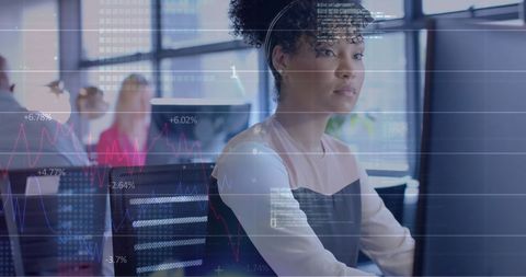 Financial Analyst Observing Global Data on Office Screen