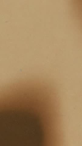 Vertical brown textured loop video showing minimalist surface for calm background use