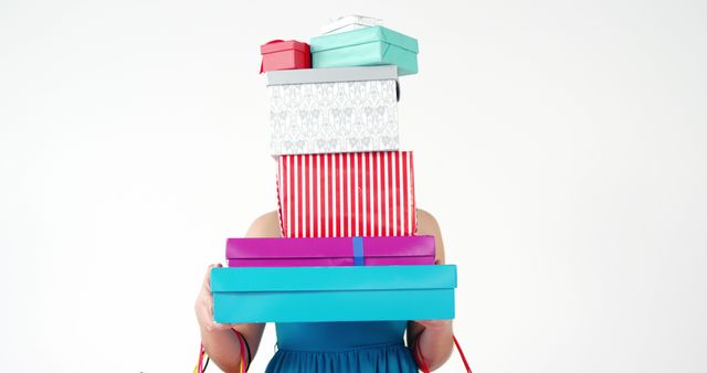 Person Holding Stack of Colorful Gift Boxes on White Background - Download Free Stock Images Pikwizard.com