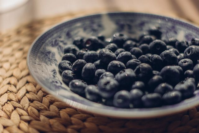 Close-Up of Fresh Blueberries in Classic Ceramic Bowl - Download Free Stock Photos Pikwizard.com