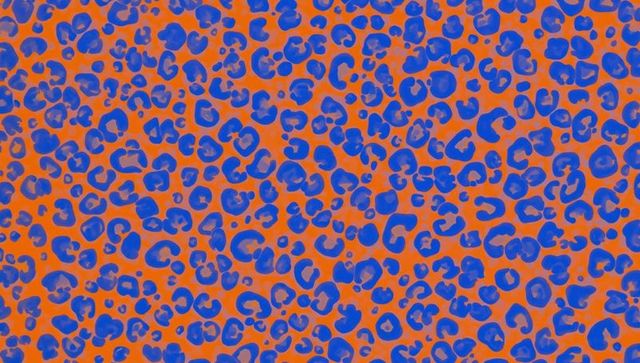 Abstract blue spots on vibrant orange pattern