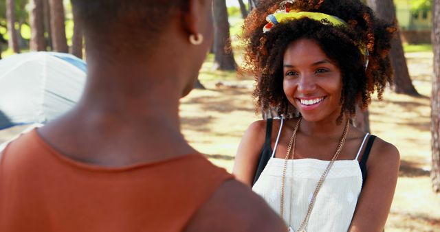 Smiling African American Woman Enjoying Conversation in Park - Download Free Stock Images Pikwizard.com