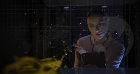 Focused Woman Analyzing Data in Server Room