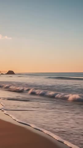 Seagull Gliding Over Soft Sunset Waves on Sandy Shoreline Vertical Coastal Video