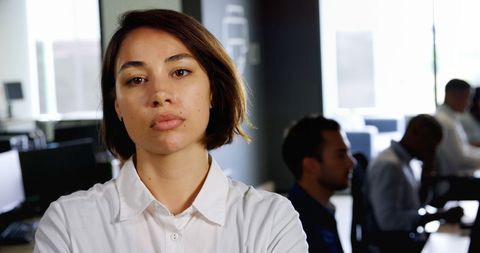Confident young businesswoman in modern office environment