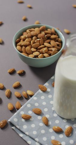 Bowl of Almonds and Milk Bottle on Polka Dot Cloth - Download Free Stock Images Pikwizard.com