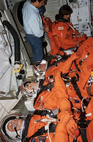 Nasa astronauts and russian cosmonauts training for mir 18 mission in shuttle mockup
