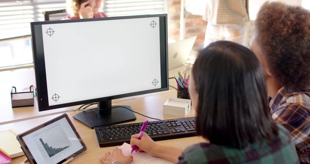 Team Collaborating in Modern Office with Blank Monitor Screen - Download Free Stock Photos Pikwizard.com