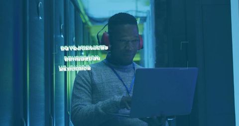 It technician analyzing data center systems in a futuristic environment