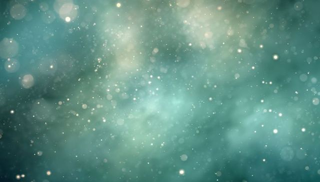 Teal green bokeh particle nebula — soft ethereal abstract backdrop with sparkling dust