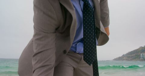 Businessman in Formal Suit Stands by Ocean - Download Free Stock Images Pikwizard.com