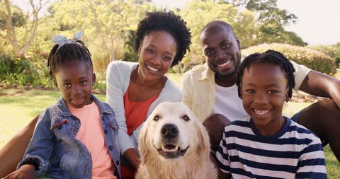 Happy African American Family Bonding with Pet Dog Outdoors - Download Free Stock Images Pikwizard.com