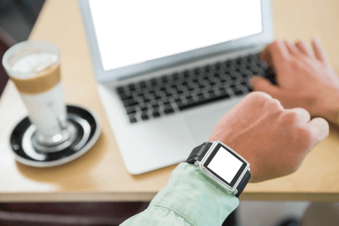 man checking smart watch during remote work session at coffee table - Download Free Stock Videos Pikwizard.com