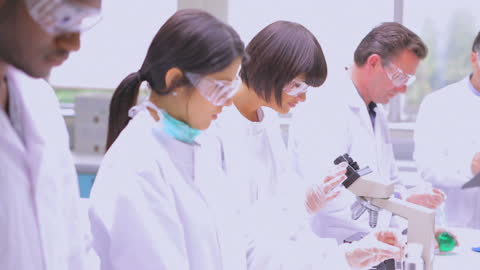Team of Scientists Conducting Research in Laboratory