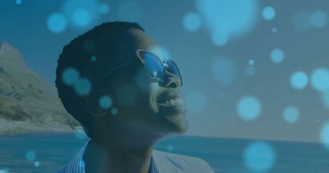 Woman admiring ocean view in cat-eye sunglasses