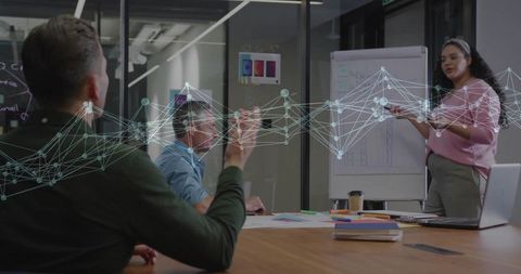 Businesswoman presenting data insights to team