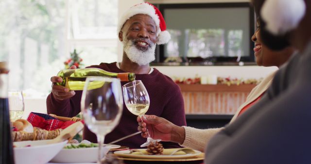 Senior Couple Celebrating Christmas with Wine at Festive Dinner Table - Download Free Stock Images Pikwizard.com