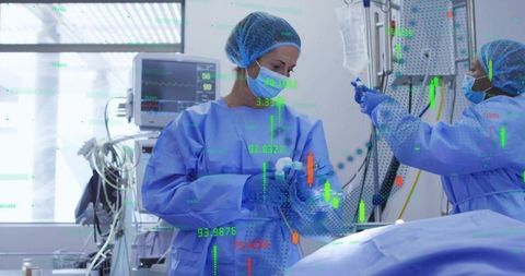 Surgical team preparing airway and administering anesthesia in sterile operating room with monitors